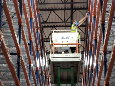 warehouse installer on lift