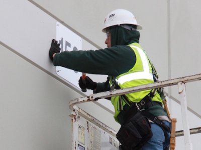 installation of exterior warehouse dock door number sign