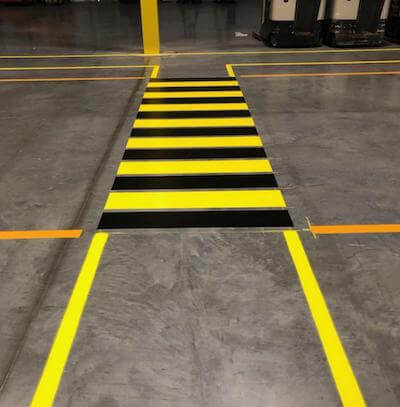 Yellow and black striped pedestrian walkway