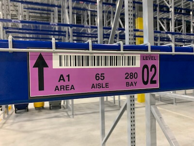 close up of warehouse magnet label on new racking